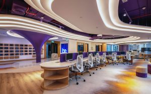 An office featuring stylish purple and white furniture, creating a modern and vibrant workspace atmosphere.